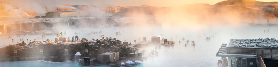 Bathing in the Blue Lagoon in Iceland at sunset.