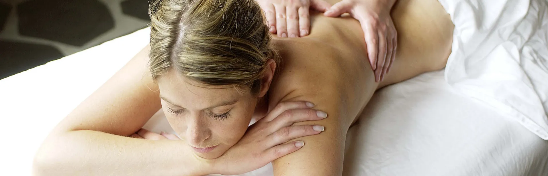 Spa break in Iceland: young women enyoing massage.