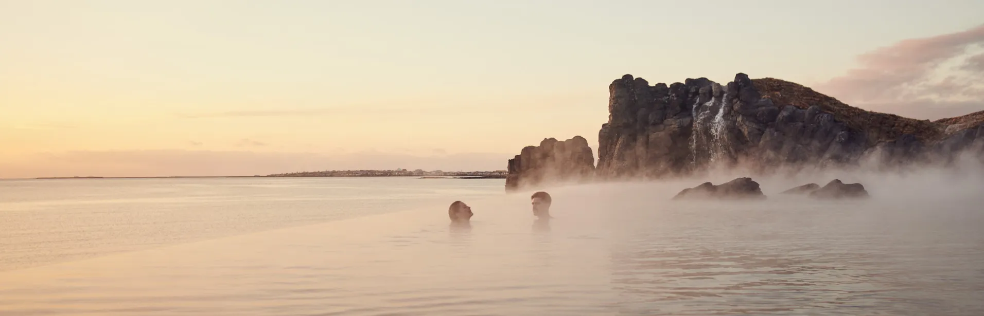 Couple taking a dip in Sky Lagoon.