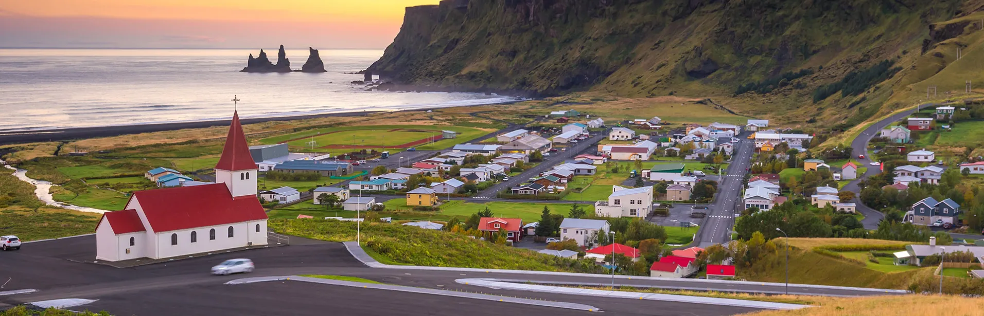 Iceland short break with rental car: aerial view of village Vík, south of Iceland.