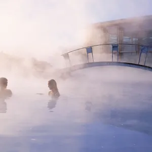 Iceland spa break at Blue Lagoon spa: couple bathing at spa Blue Lagoon, south of Iceland.