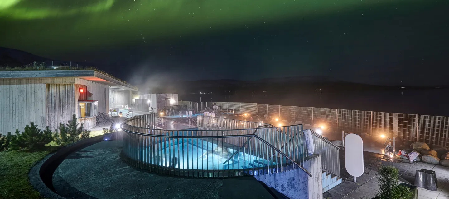 Geothermal bathing under the northern lights in Iceland.